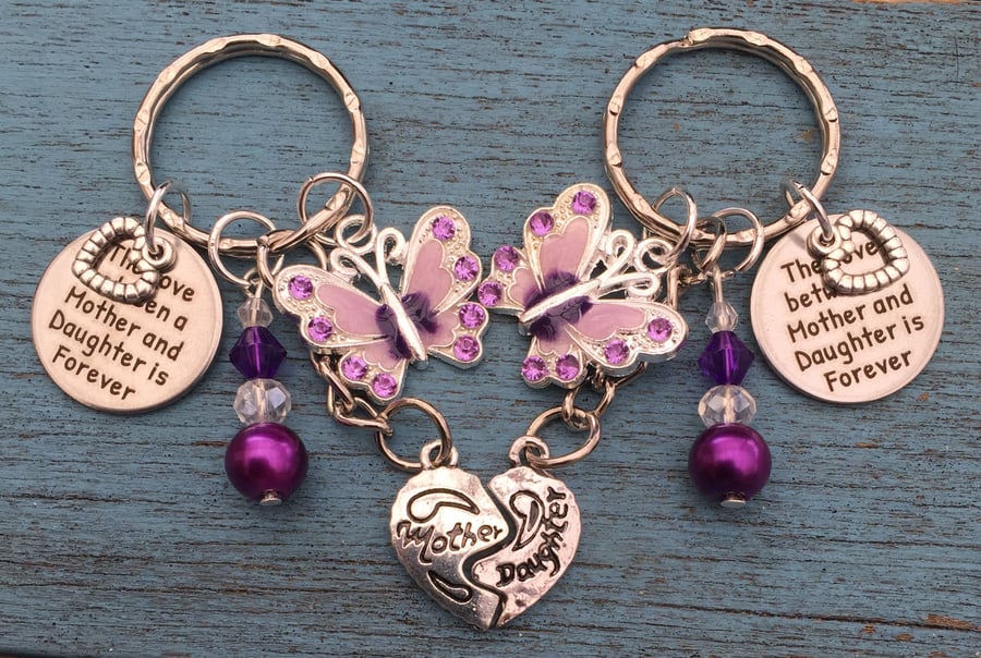 The love between a Mother and Daughter is Forever matching keyrings butterfly 