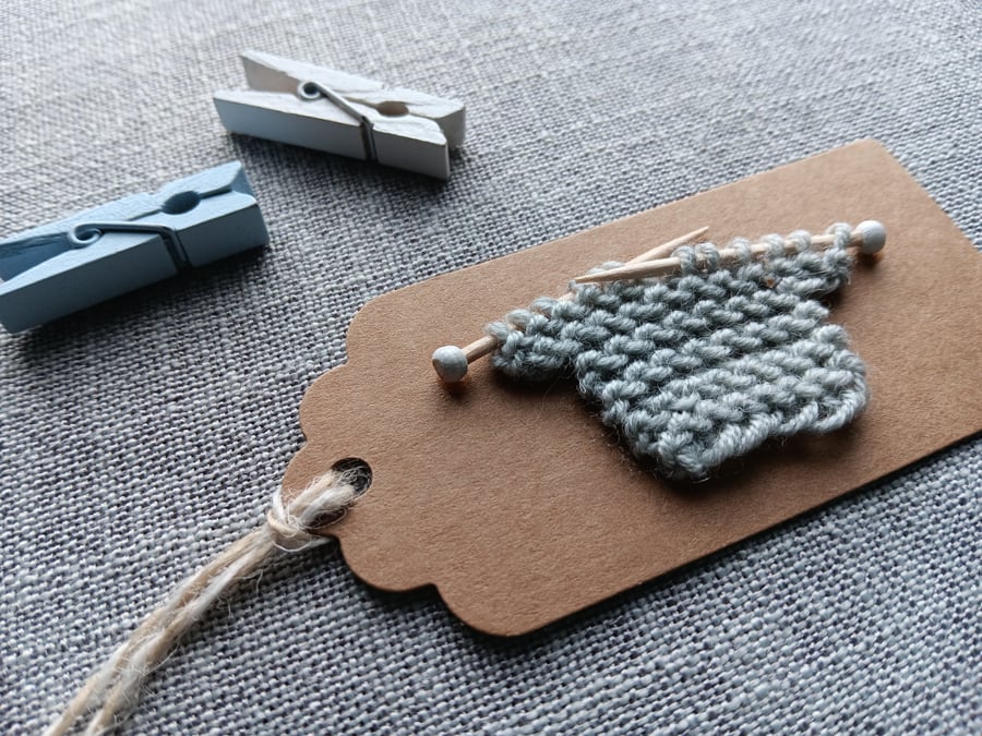 Handmade gift tag with tiny knitted jumper in grey wool New Baby