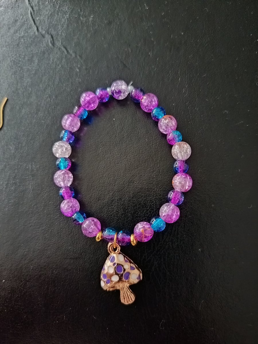 Elasticated purple and blue beaded cottage core bracelet with toadstool charm 