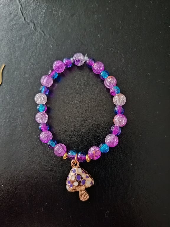 Elasticated purple and blue beaded cottage core bracelet with toadstool charm 