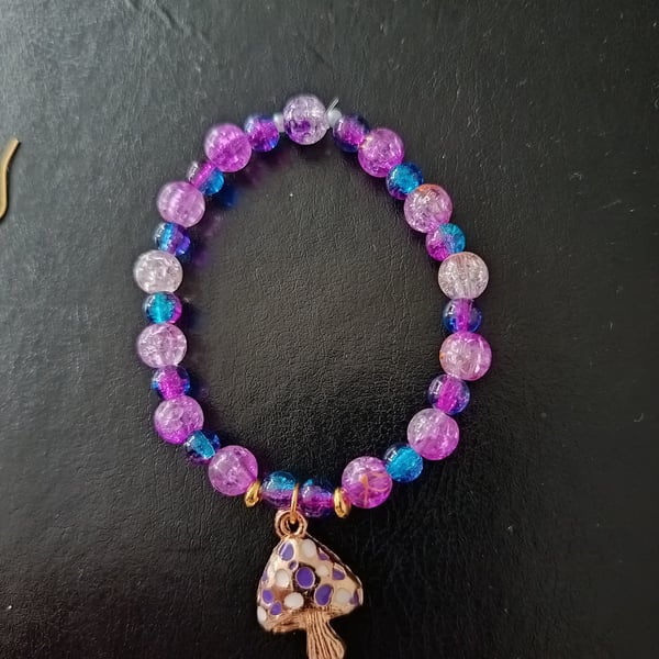 Elasticated purple and blue beaded cottage core bracelet with toadstool charm 
