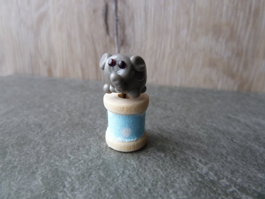 wooden spool with elephant