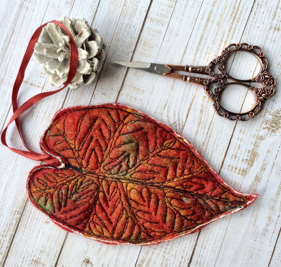 Handmade felt embroidered leaf decoration. 