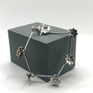 Solid silver daisy chain bracelet with hallmarked toggle clasp