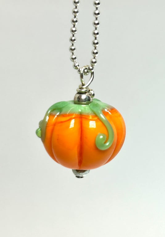 Handmade Halloween pumpkin bead on a Stirling silver chain