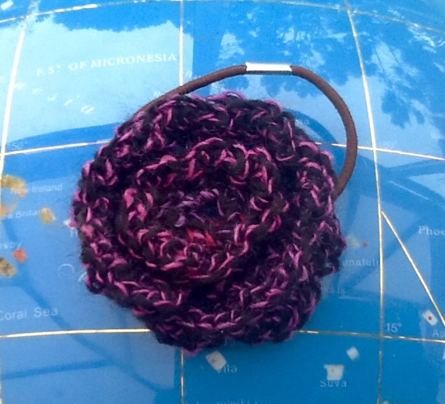 Winter Berry Rose Crocheted Hair Accessory with integrated hair elastic.