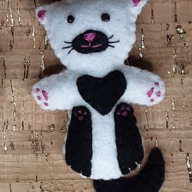 Cat on back White Felt Brooch with black legs, tail, chest & muzzle.