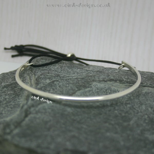 Sterling silver bangle with adjustable cord