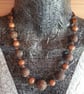 Conker brown, black and gold handmade polymer clay necklace