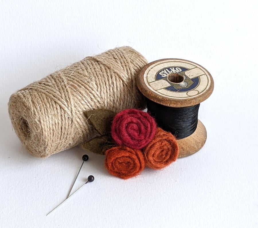 Small felted roses brooch in shades of rusty orange 