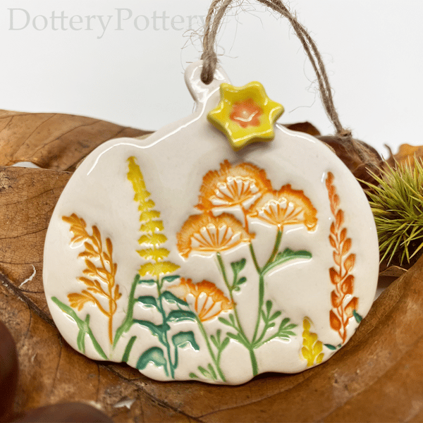 Ceramic pumpkin decoration with flower