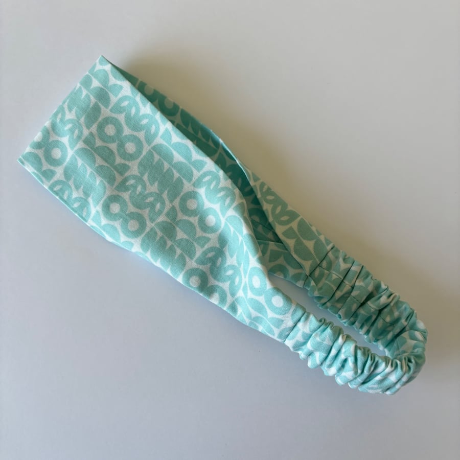 Cotton wide flat headband, yoga headband, in a turquoise and white print