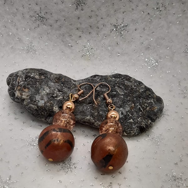 Conker brown and black dangly earrings with a bronze sheen