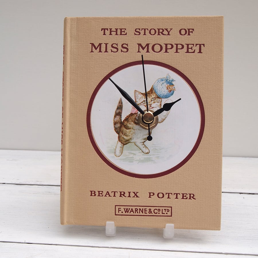 Miss Moppet beige book clock made from the Beatrix Potter tale of the kitten