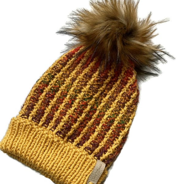 Hand knitted Adult beanie hat in gold with faux fur pompom