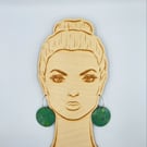 Green wooden disc earrings with a touch of white and yellow