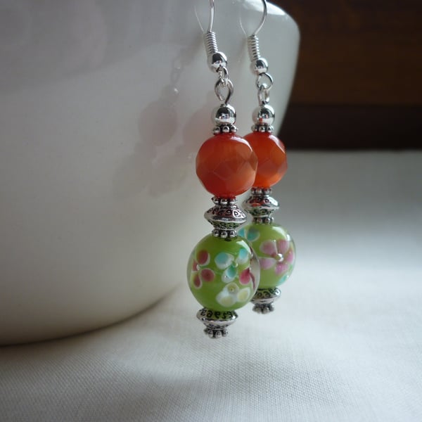 BURNT ORANGE, GREEN AND SILVER DANGLE EARRINGS.