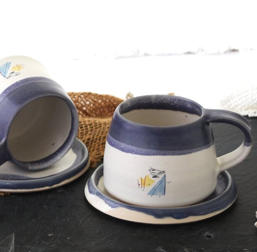 Handmade coast inspired blue and white ceramic cup and saucer set 