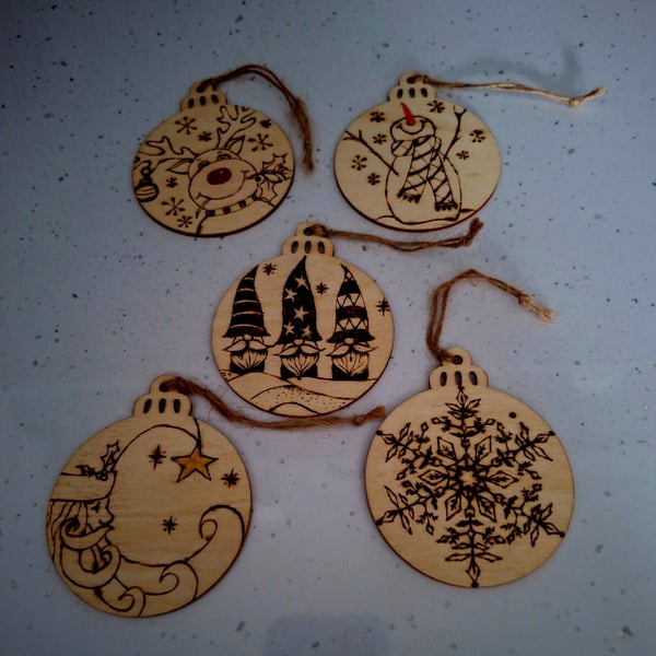 Pyrographed festive hanging bauble-shaped discs