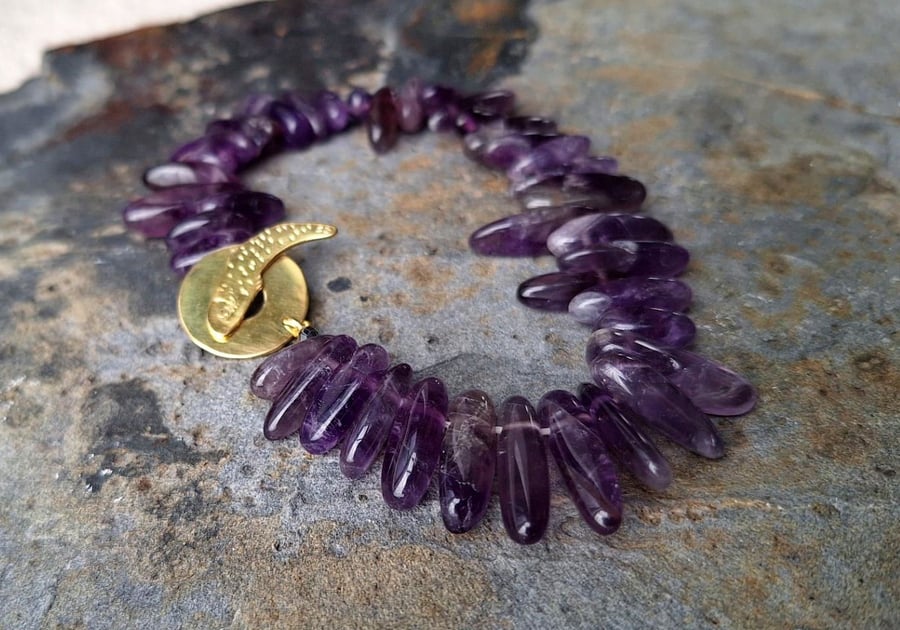 Bracelet from Amethyst with brass clasp