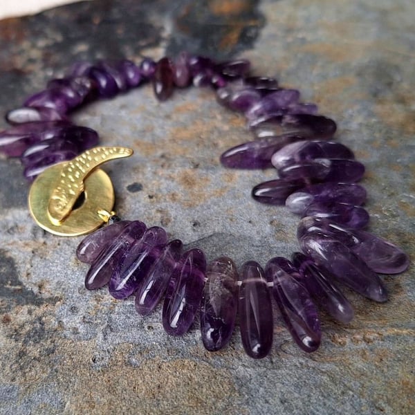 Bracelet from Amethyst with brass clasp
