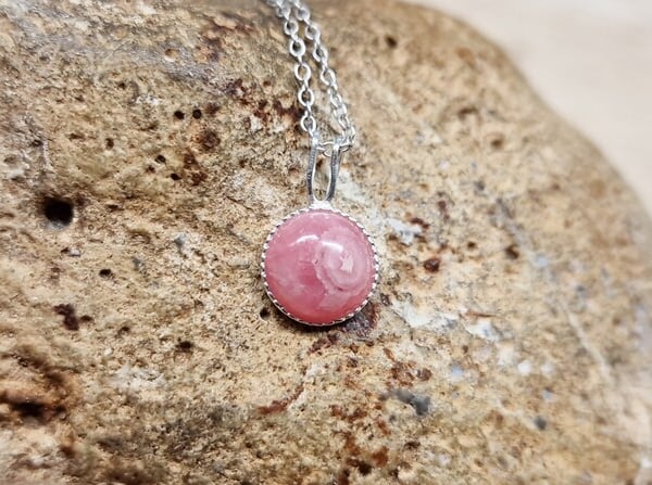 Tiny round rhodochrosite pendant necklace. 8mm 925 sterling silver
