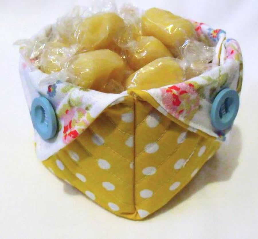 yellow folded fabric storage tub for your bits and bobs