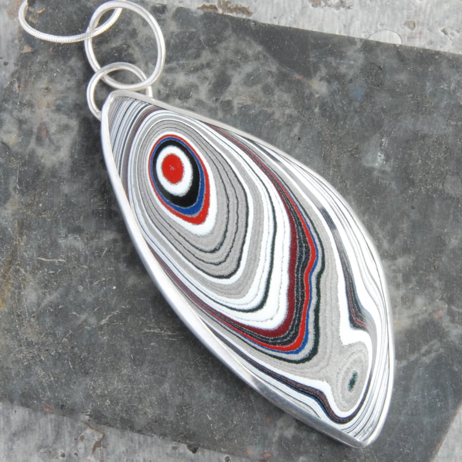 Sterling silver and fordite 'feather ' pendant