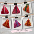 Dinky triangle purses for phone chargers