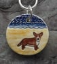 Handmade Ceramic Corgi dog on the beach pendant - Image 1
