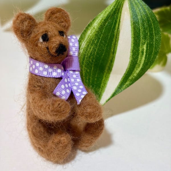 Rueben is a tiny brown needle felted bear