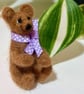 Rueben is a tiny brown needle felted bear