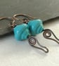 Copper earrings with teal lamp work bead and wire work - Image 2