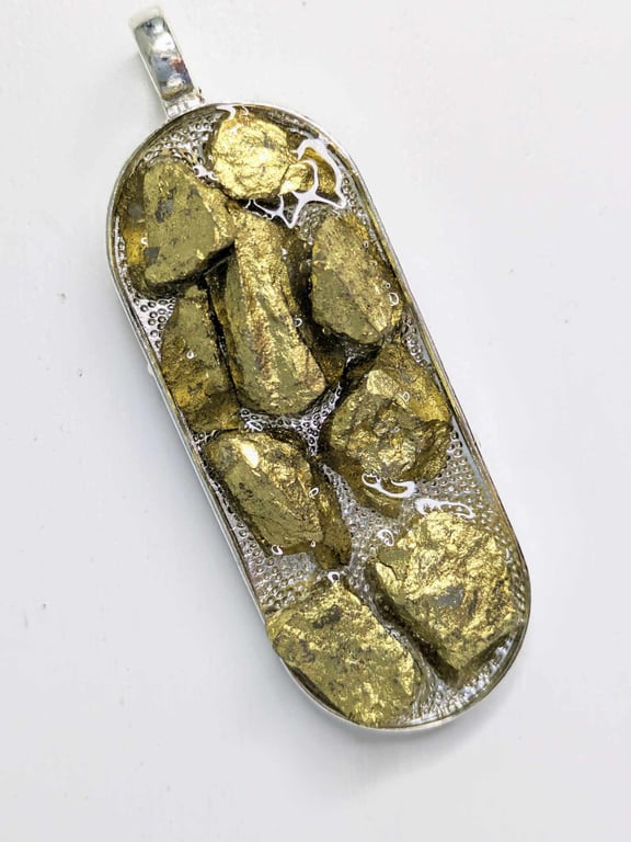 Stretched Oval Pendant With Gold Rocks