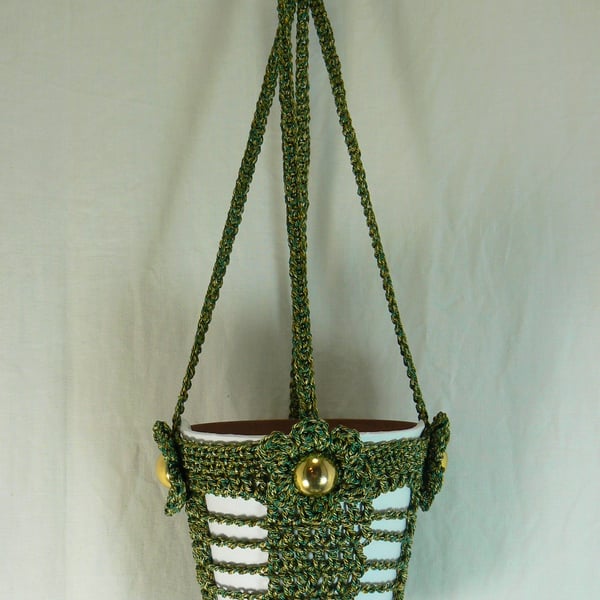 Crocheted hanging plant holder ( green and gold) with flower detail
