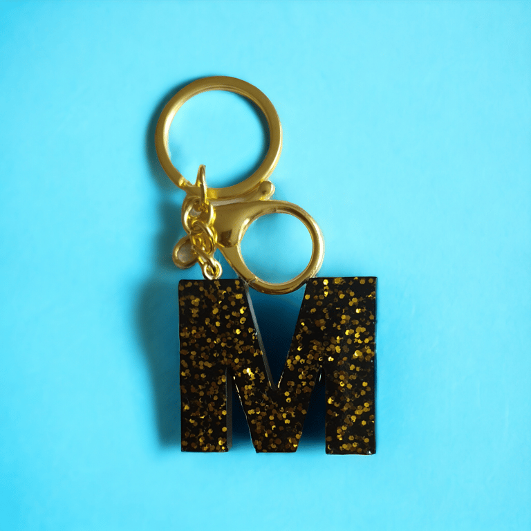 Handmade resin keyring with M on it