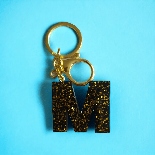 Handmade resin keyring with M on it