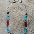 "Neo" - Tie fastening beaded necklace on thin leather cord - red & blue