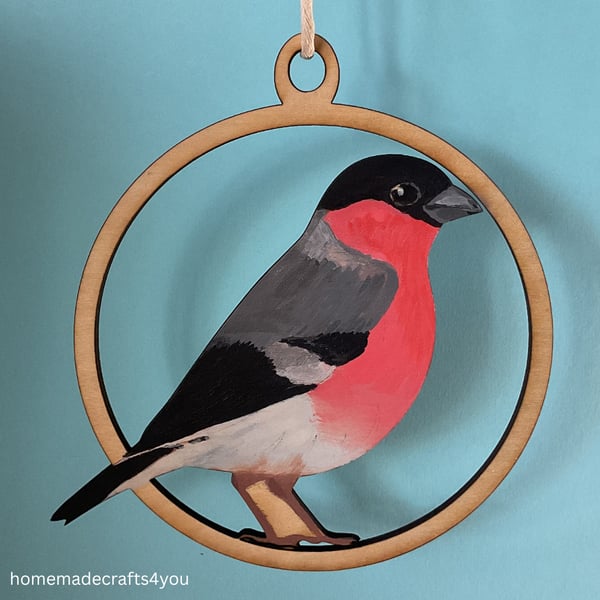 Hanging wooden decoration of a Bullfinch