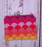 Rainbow coin zip purse with red lining