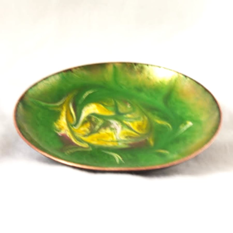 enamelled dish: scrolled white, gold and pink on green over clear