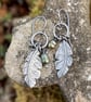 Oxidised silver feather and green pearl earrings - Image 1