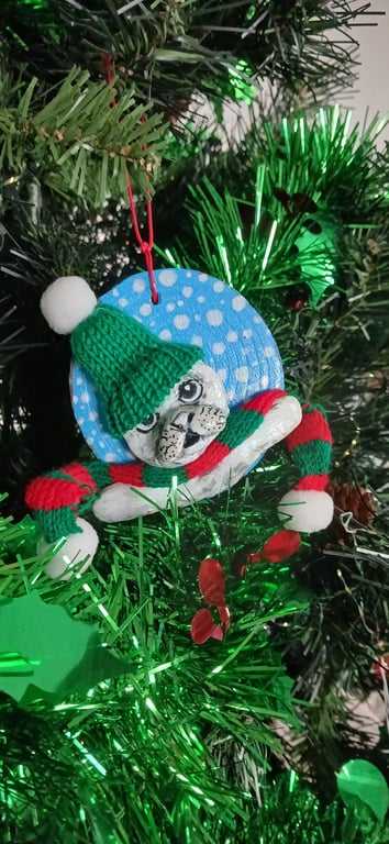 Christmas tree decoration of a Seal, airdry clay with a fabric hat and scarf.  
