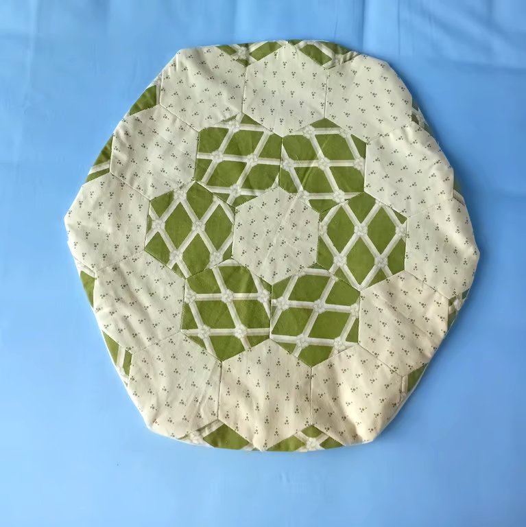 Round cushion cover in green & cream patchwork Laura Ashley. Slightly imperfect.