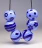 Handmade light blue and dark blue patterned lamp work glass beads