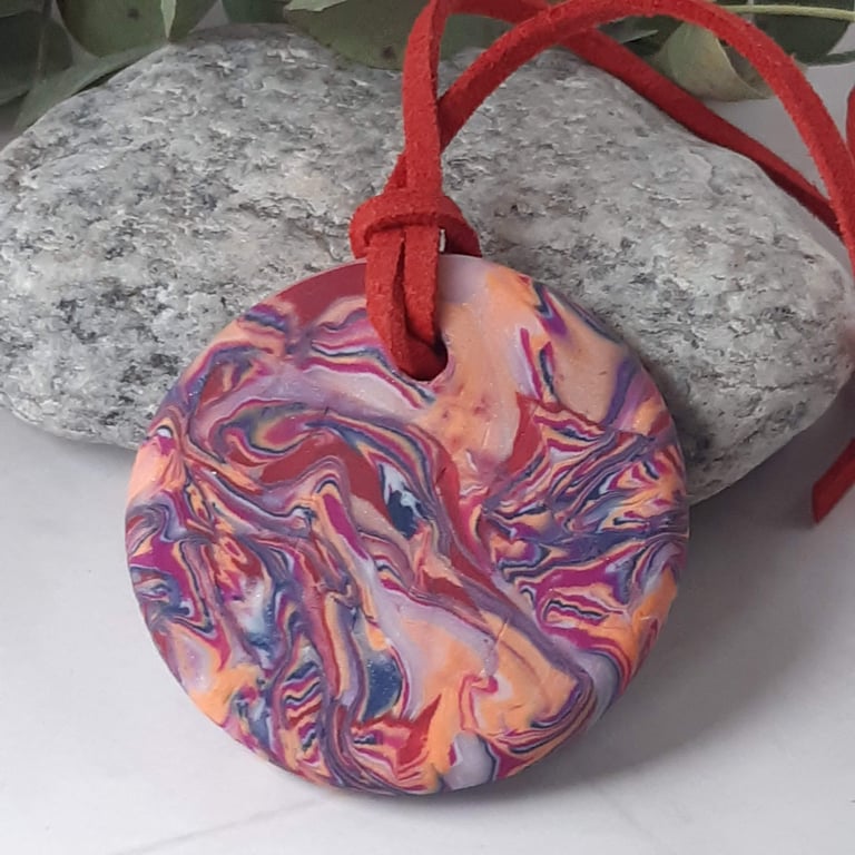 Brightly coloured handmade polymer clay round pendant