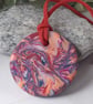 Brightly coloured handmade polymer clay round pendant