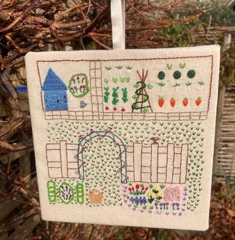 Hand embroidered cottage garden picture.