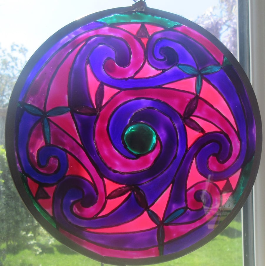 Suncatcher - Celtic spirals in purples and pinks with green centre - large