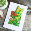 Handmade card. Lime cat in the garden